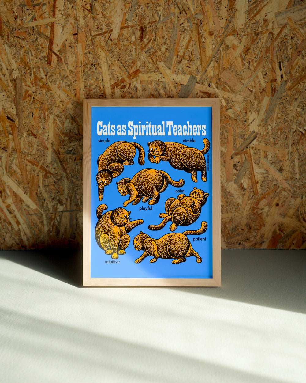 Catz wall art by Jake Foreman in a natural wood frame