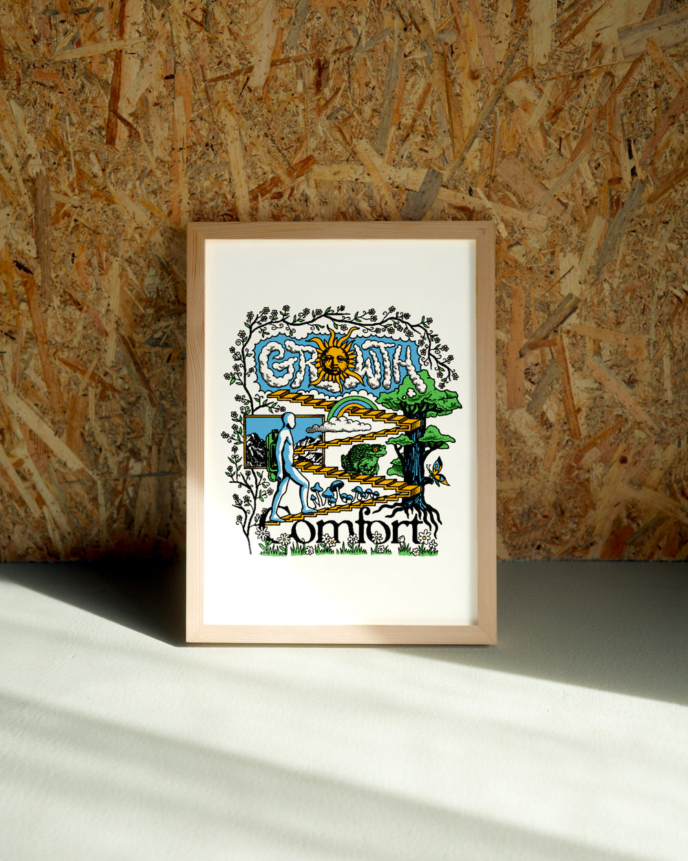 Comfort wall art by Jake Foreman in a natural wood frame