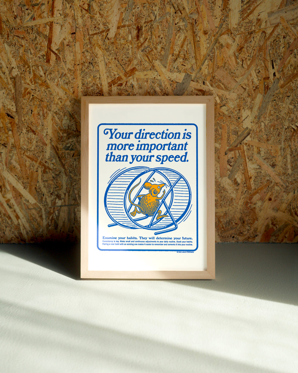 Direction wall art by Jake Foreman in a natural wood frame