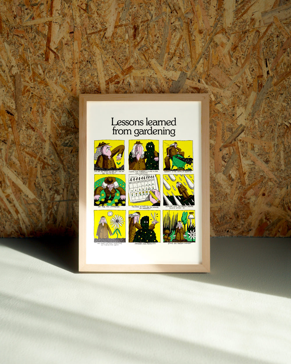 Gardening wall art by Jake Foreman in a natural wood frame