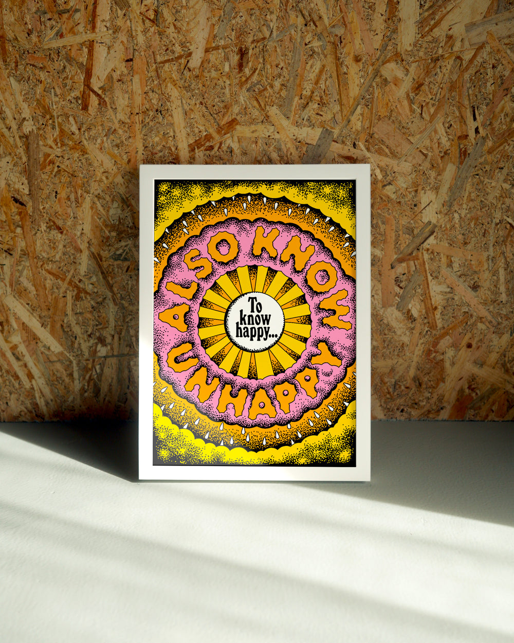 Happy wall art by Jake Foreman in a white frame