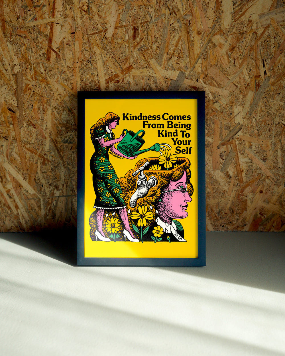 Kindness wall art by Jake Foreman in a black frame
