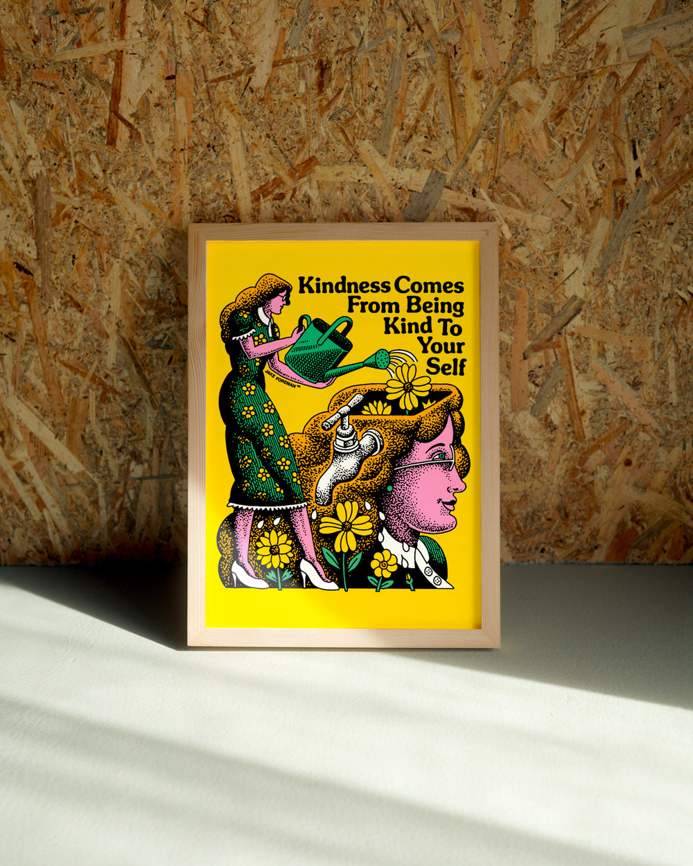 Kindness wall art by Jake Foreman in a natural wood frame