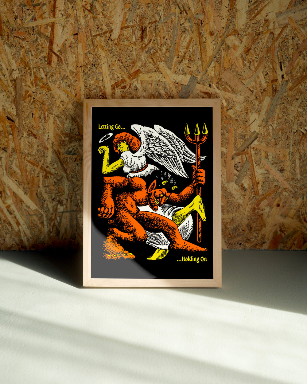 Let Go wall art by Jake Foreman in a natural wood frame