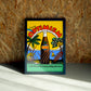 Optimism wall art by Jake Foreman in a black frame