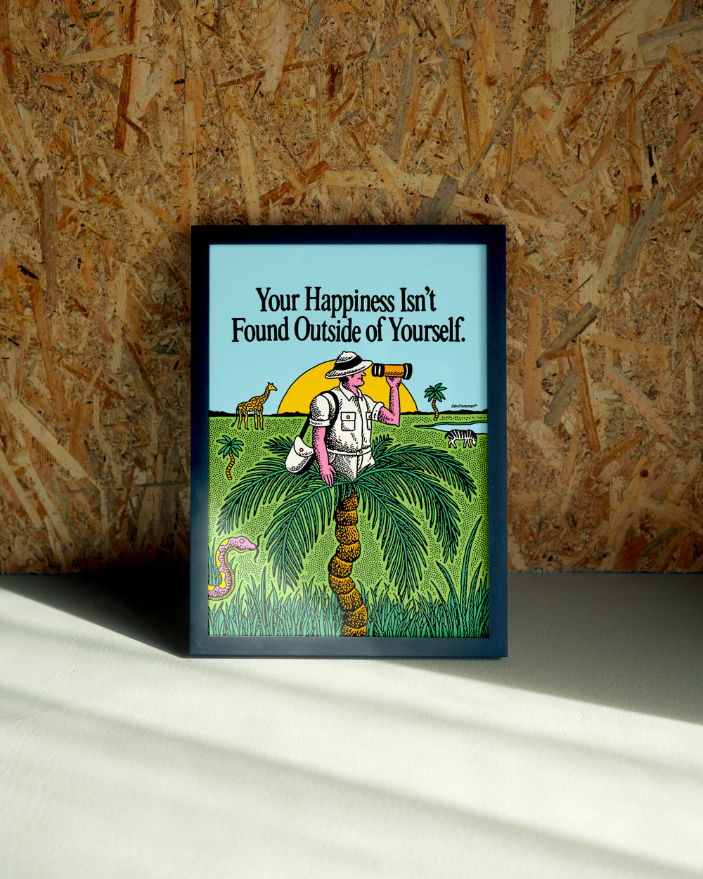 Outside wall art by Jake Foreman in a black frame