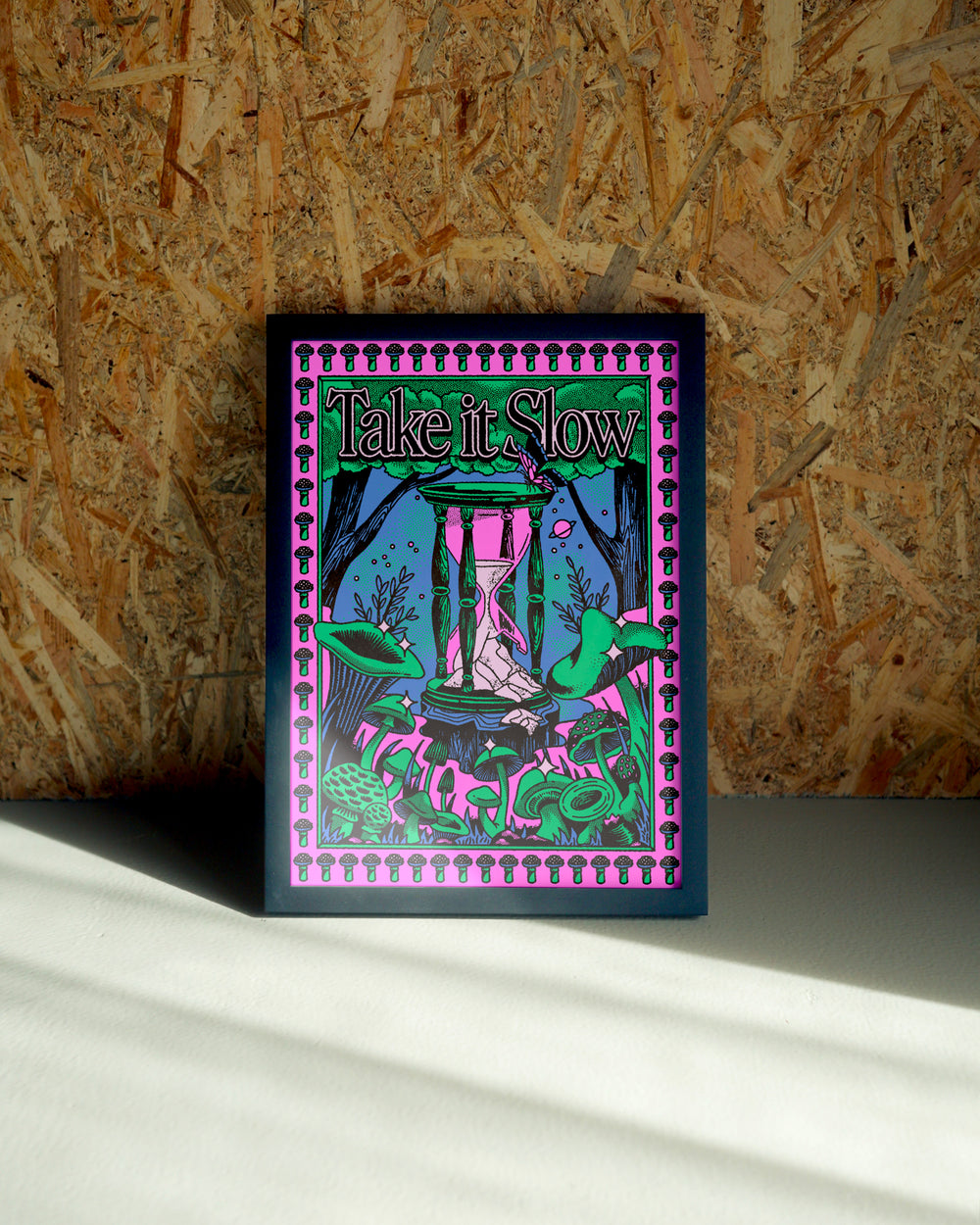 Take It Slow wall art by Jake Foreman in a black frame