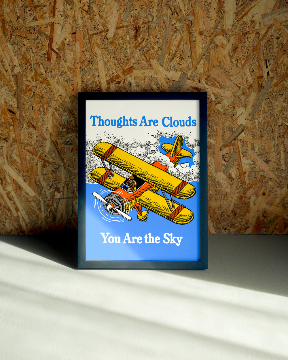 Thoughts wall art by Jake Foreman in a black frame